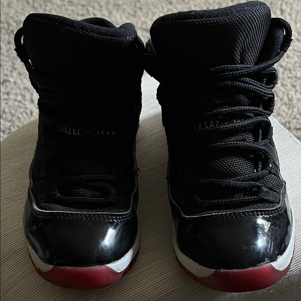 Jordan 11 Kids Black and Red Sneakers